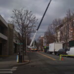 A crane, several stories tall, climbs into the sky above So Broadway on 3/30/09