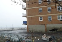 The parking lot of West Shore Apts on Gedney St. 
A large hole can be seen in the wall of the underground parking garage.