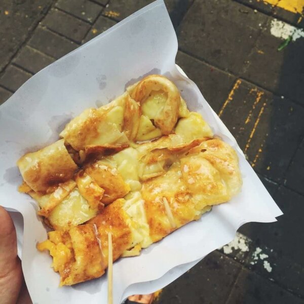 Roti with banana and egg, drizzled with condensed milk